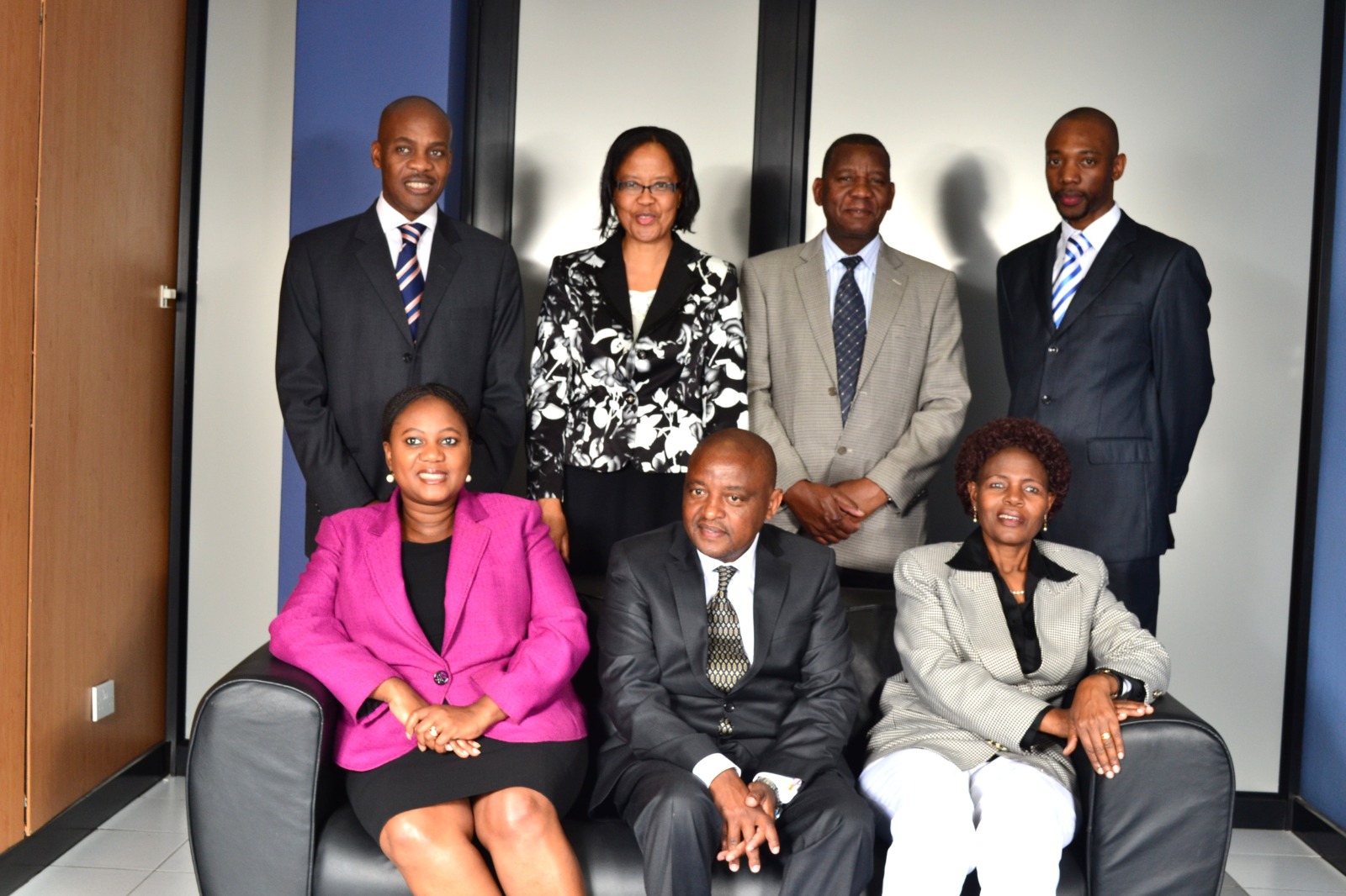 Faith Mabu Nteta in a formal group portrait with colleagues
