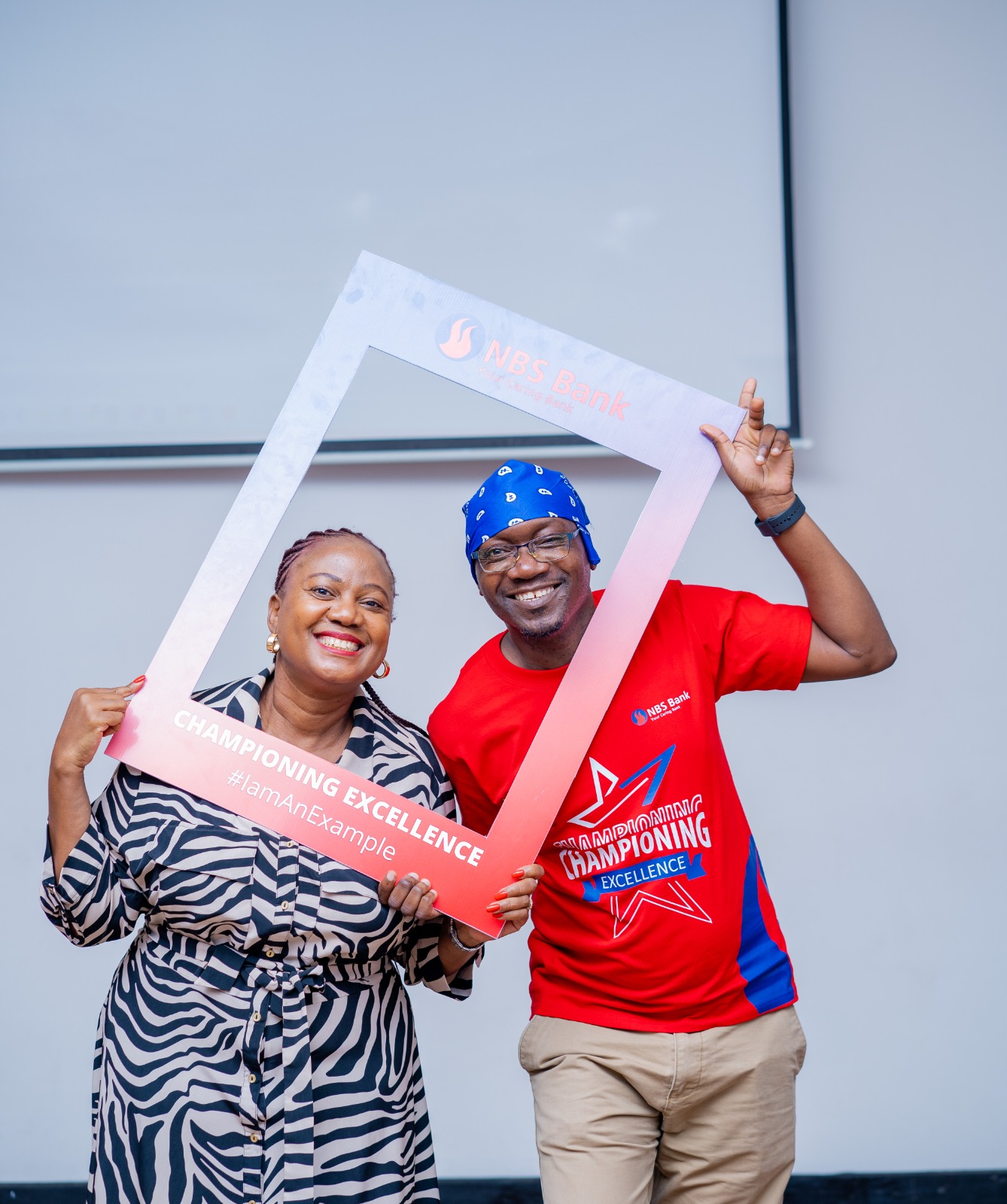 Faith Mabu Nteta and a team member posing during a team-building event